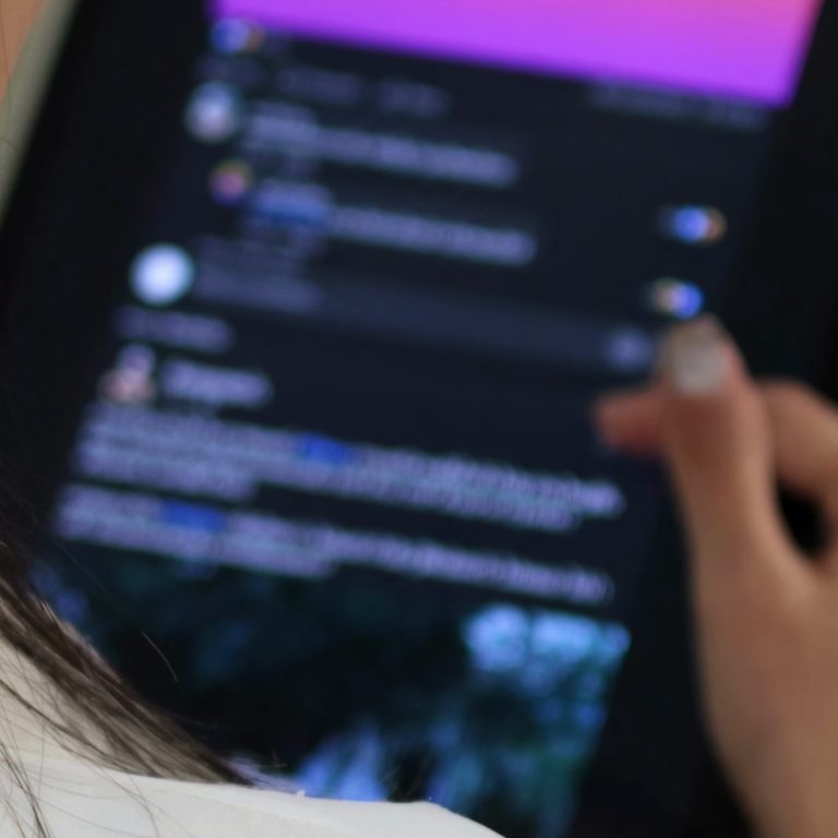 closeup-shoulder-view-woman-using-tablet-social-media